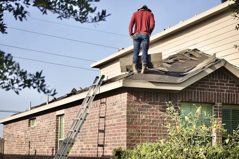 Professional roofer working on a residential roof in View Park-Windsor Hills